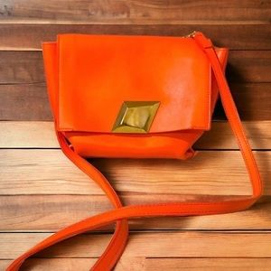 MCM Crossbody - stunning bag adds the pop to traditional MCM bag.